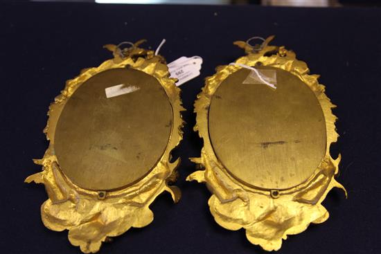 A pair of ormolu mounted Sevres style porcelain wall plaques, late 19th century, 24cm